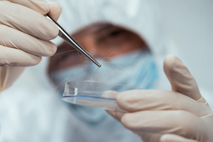 Forensic scientist examining DNA