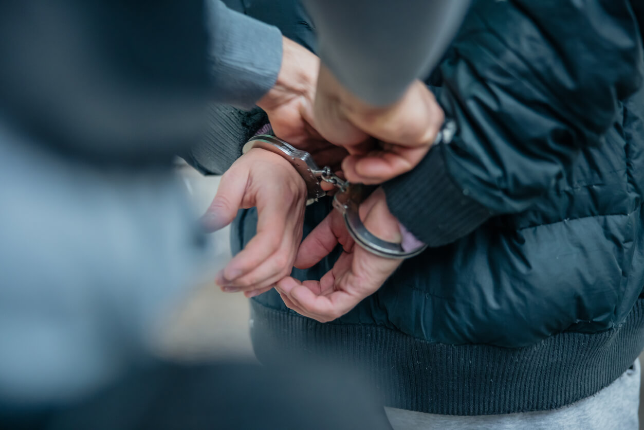 handcuffs on criminal