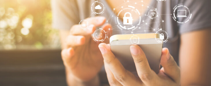 Woman using smartphone with icon graphic cyber security network of connected devices and personal data information